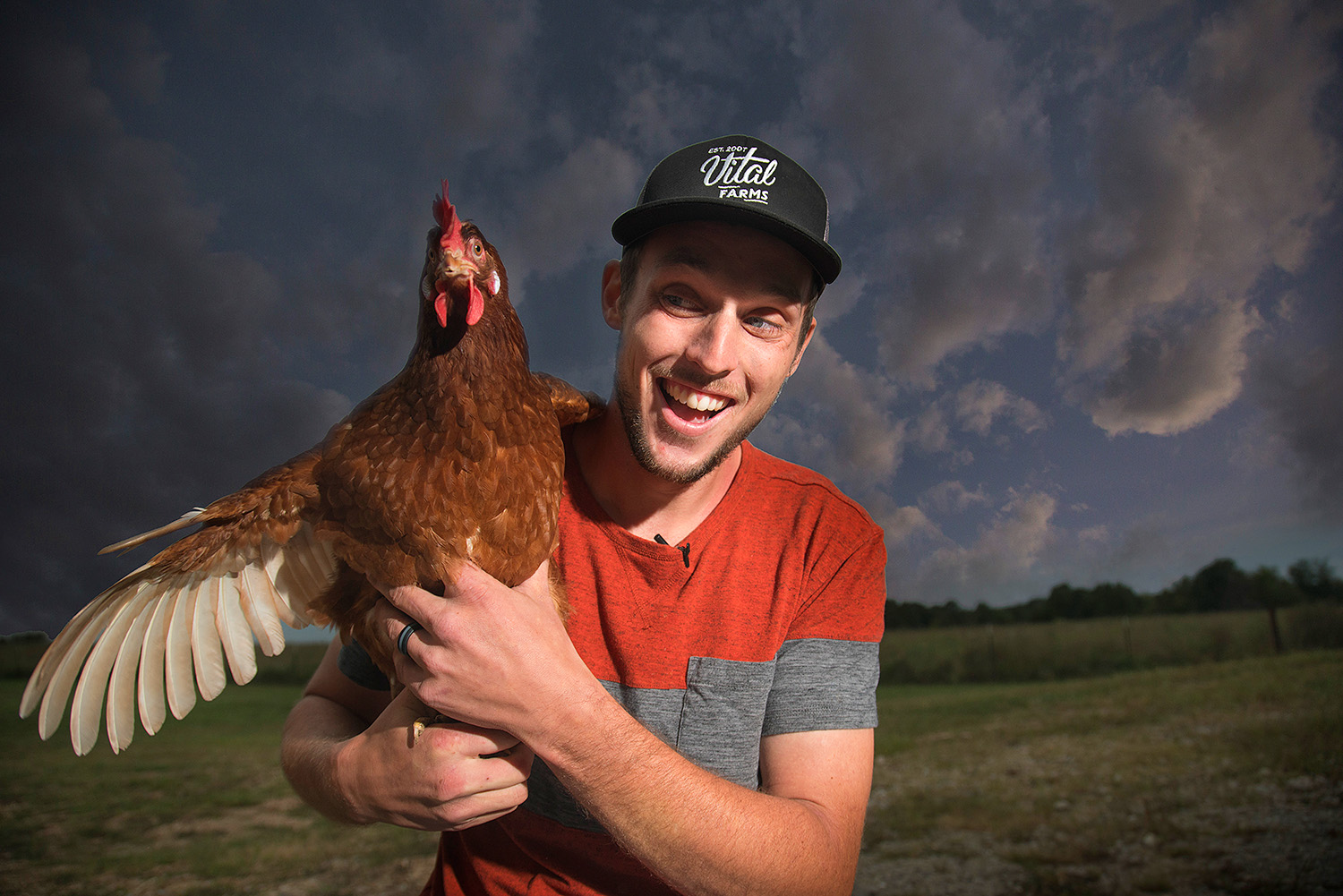 portrait of farmer with chicken Portraits
